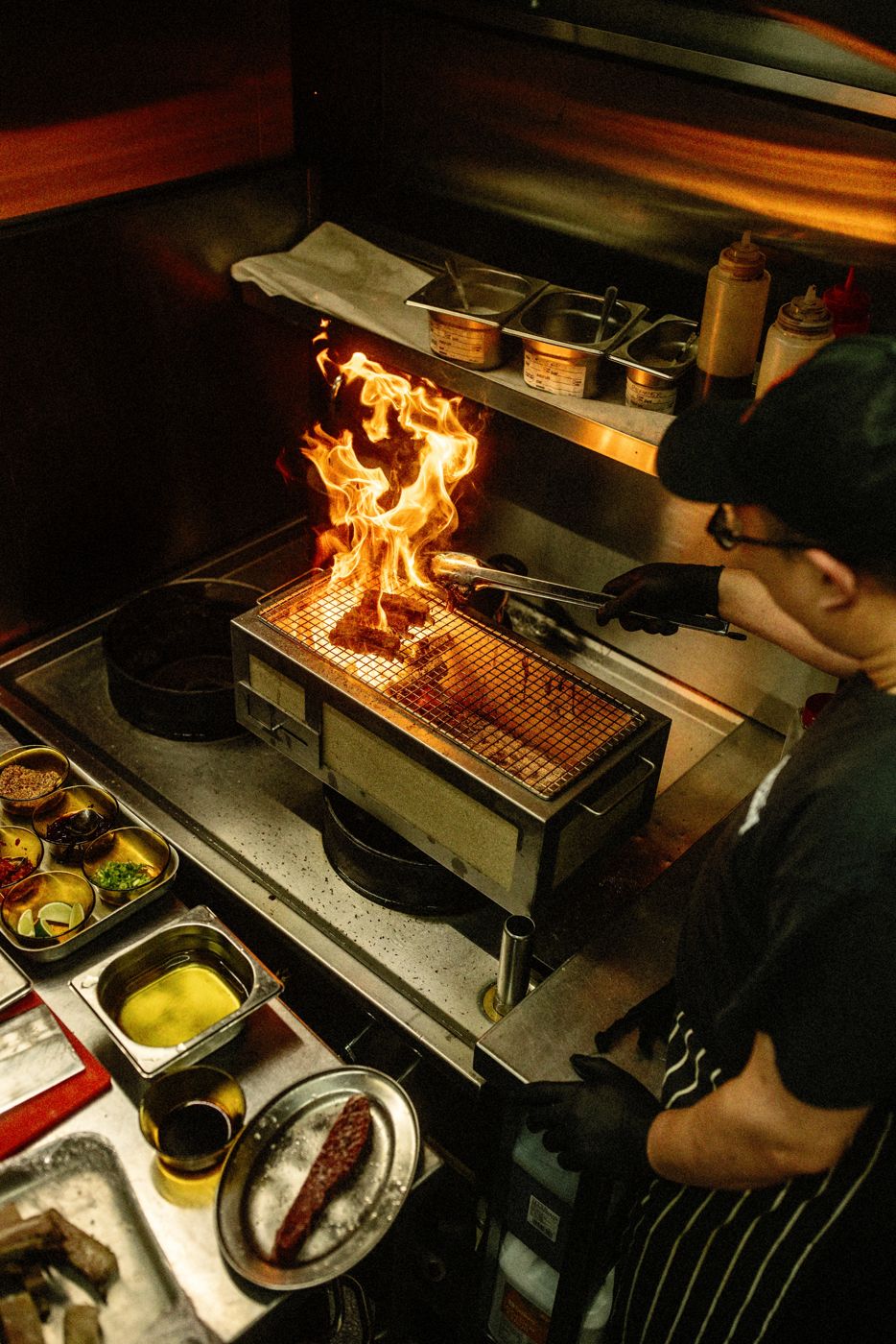 Flames over the grill in the BIGFAN kitchen
